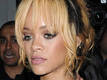 Rihanna takes a swipe at fan with... Rihanna takes a swipe at fan with...