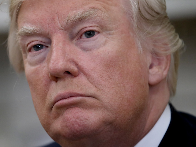 Trump touts tax plan, trucks in speech