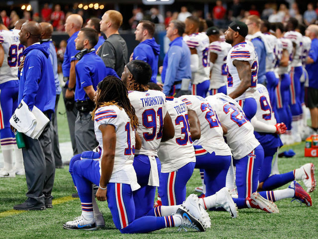NFL owners approve policy for players kneeling during national anthem