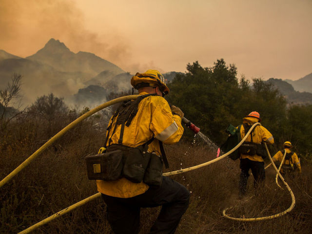 'It's not over yet.' High winds threaten progress made fighting California fires
